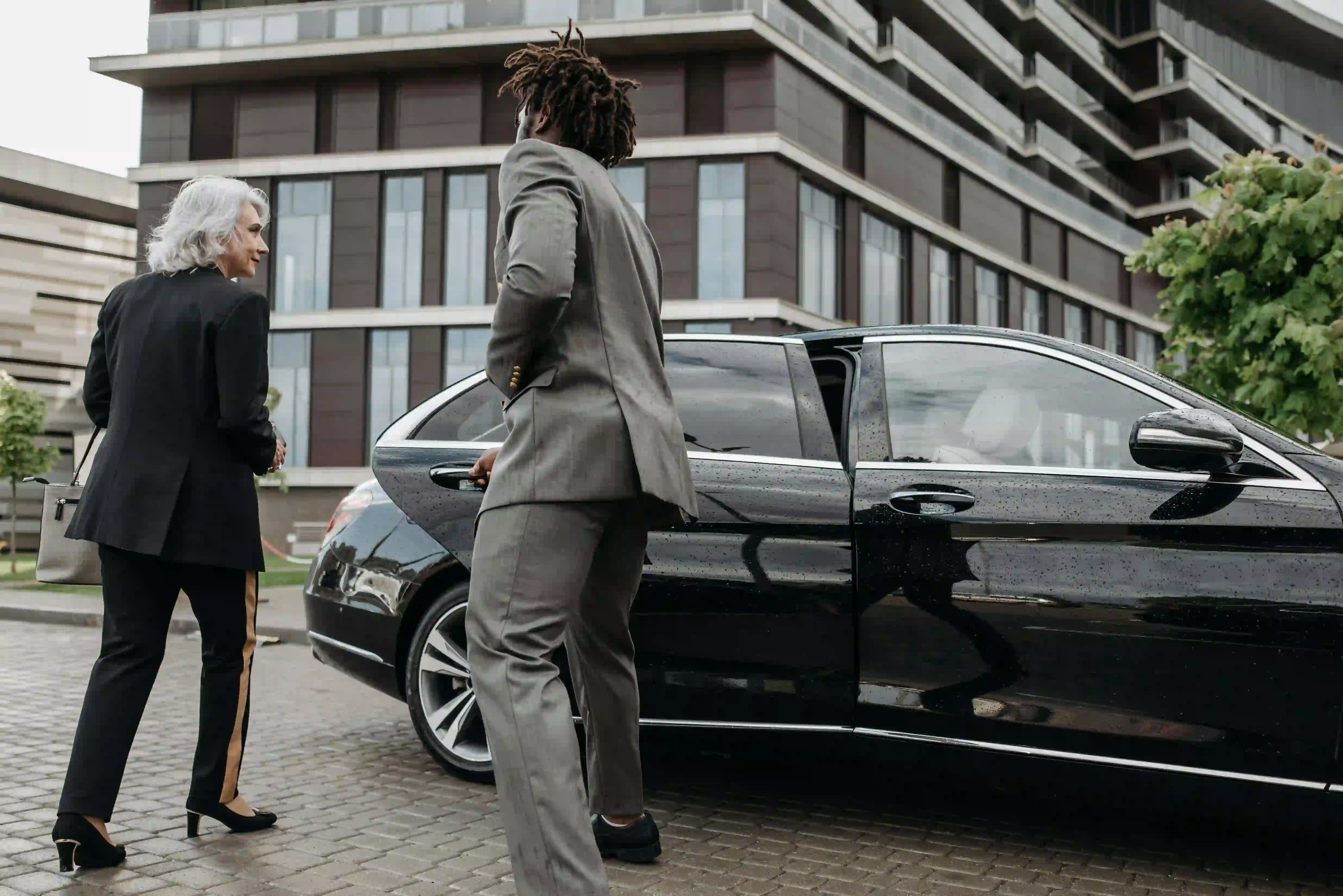 Business people entering vehicle
